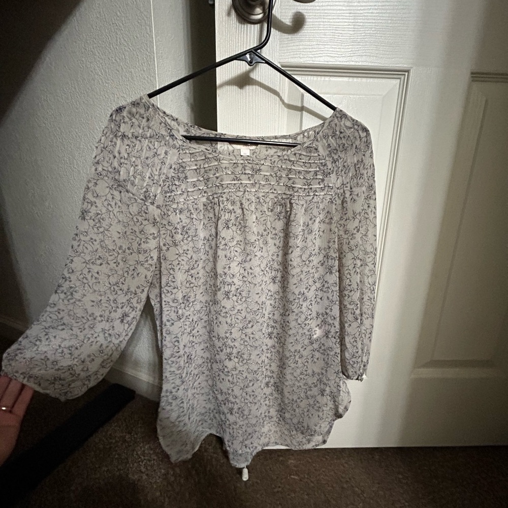 A gray with light purple flowers see through top size M good layering